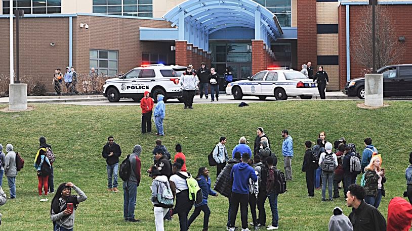 Belmont High School students evacuate the building in March after rumors circulated that a student was inside with a gun. MARSHALL GORBY / STAFF