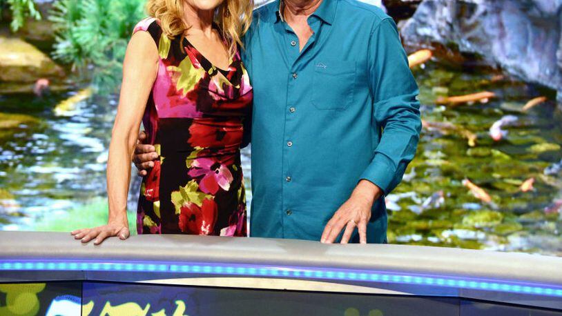 'Wheel of Fortune' hosts Vanna White (L) and Pat Sajak attend a taping of the show's 35th Anniversary Season at Epcot Center at Walt Disney World in Orlando, Florida.
