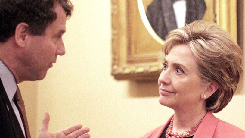 Democratic presidential hopeful Sen. Hillary Rodham Clinton, D-N.Y., speaks with Sen. Sherrod Brown, D-Ohio, an uncommitted Democrat Superdelegate, Tuesday, May 13, 2008, outside the Senate Chamber on Capitol Hill in Washington. (AP Photo/Lauren Victoria Burke)