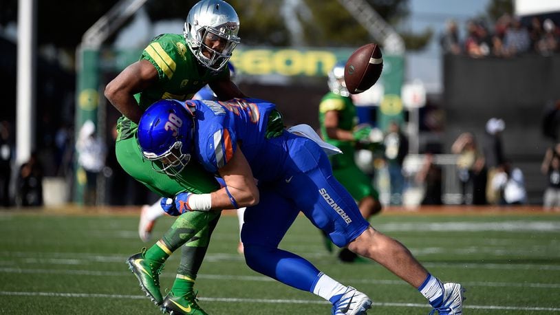 LAS VEGAS, NV - DECEMBER 16: Tony Brooks-James #20 of the Oregon Ducks fumbles the ball under pressure from Leighton Vander Esch #38 of the Boise State Broncos during the first half of the Las Vegas Bowl at Sam Boyd Stadium on December 16, 2017 in Las Vegas, Nevada. Boise State won 38-28. (Photo by David Becker/Getty Images)