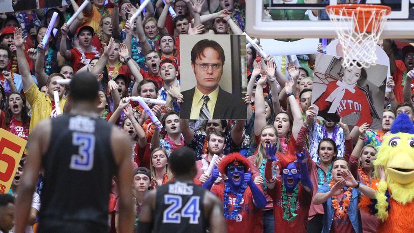Fans in the Dayton student section try to distract Aaron Hines, of Saint Louis, as he shoots a free throw late in the game on Tuesday, Feb. 20, 2018, at UD Arena. David Jablonski/Staff