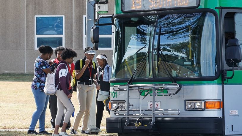 Dayton Public Schools reintroduced busing for high school students this fall, with a temporary system through September, then special “limited service” RTA routes since then. CHRIS STEWART / STAFF