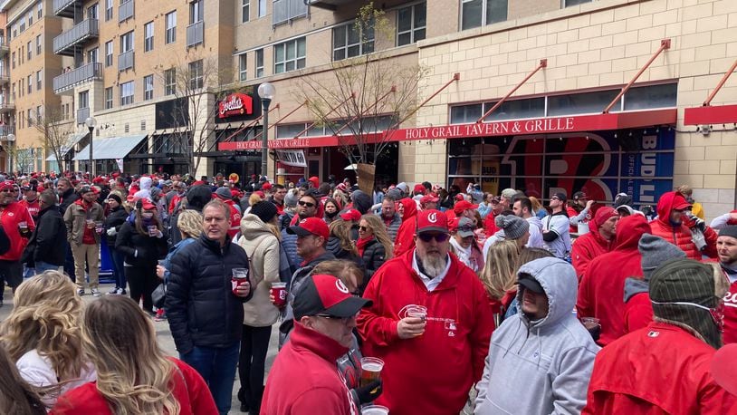 Fans mill around The Banks on Opening Day before a game between the Cincinnati Reds and St. Louis Cardinals on Thursday, April 1, 2021, at Great American Ball Park in Cincinnati. DAVID JABLONSKI/STAFF