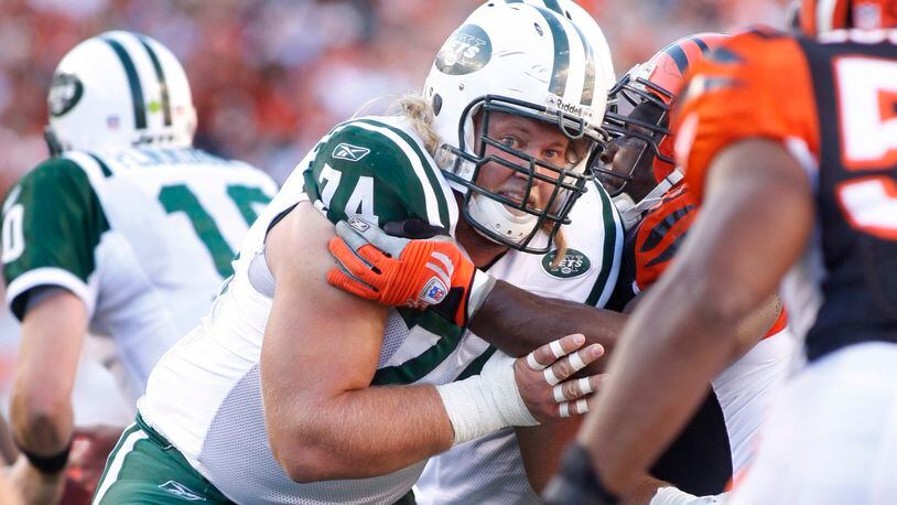 Nick Mangold, the starting center on the Jets offensive line, blocks for the Jets. Mangold graduated from Centerville High School and played for Ohio State.