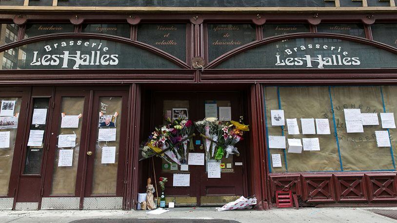 A memorial with flowers, notes, and pictures in memory for the late celebrity chef Anthony Bourdain in front of his former New York restaurant, Brasserie Les Halles, at 411 Park Ave South, in Manhattan, on Friday, June 8, 2018. (Shawn Inglima/New York Daily News/TNS)
