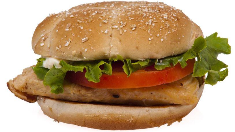A Florida woman was arrested on charges she put a plastic handcuff key inside a chicken sandwich while visiting her husband who is incarcerated at Florida State Prison.