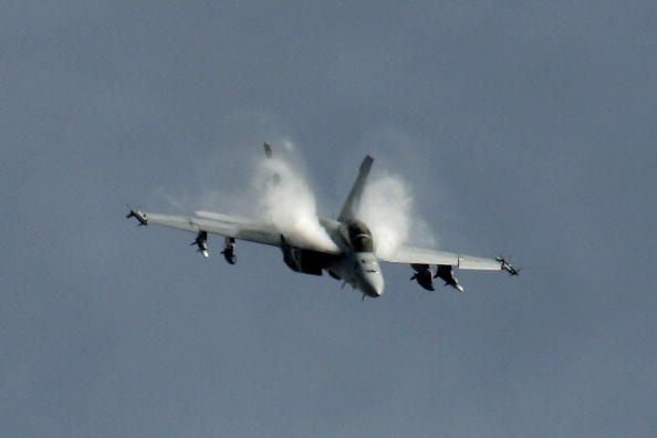 Boeing F/A-18 Super Hornet replaced the Grumman F-14 Tomcat (which was retired in 2006)