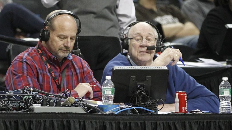 WHIO’s Larry Hansgen, left, and Bucky Bockhorn broadcast the Flyers’ victory over Fordham in the second round of the A-10 tournament on Thursday, March 13, 2014, at the Barclays Center in Brooklyn, N.Y. David Jablonski/Staff