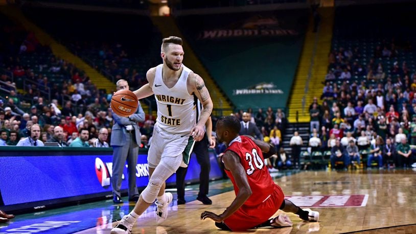 Wright State s Bill Wampler drives around Miami s Aboulaye Harouna earlier this season. Wampler scored a team-high 19 points Saturday night vs. Mississippi State. Joseph Craven/CONTRIBUTED