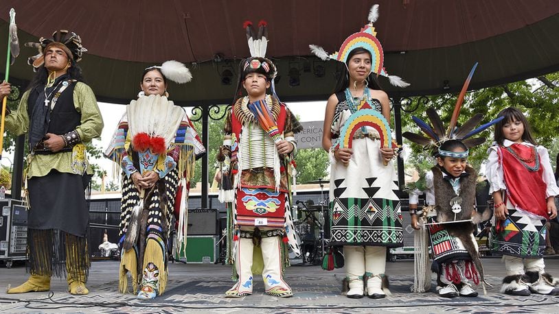This Aug. 23, 2015, photo shows Male and Female Adult, Youth and Child category winners in the 2015 Santa Fe Indian Market Fashion Challenge of the Native American Clothing Contest at the Santa Fe Indian Market in Santa Fe., N.M. For nearly a century, American Indian jewelers, potters and other artists have been gathering in the heart of northern New Mexico to show off their creations at one of the nation's most prestigious art markets. The annual Santa Fe Indian Market begins Saturday, Aug. 19, 2017. (Phil Karshis/Courtesy of SWAIA/Santa Fe Indian Market via AP)