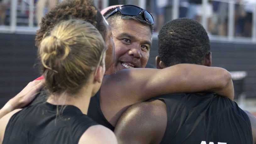 Wayne track and field coach Mike Fernandez celebrates at the regional with the Warriors. JEFF GILBERT / CONTRIBUTED
