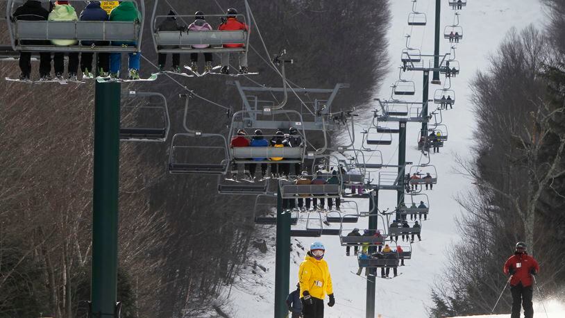 In this Thursday, Feb. 14, 2013 file photo, skiers ride a lift at the Sugarbush ski resort in Warren, Vt. here’s nothing like a bunch of snow to get skiers and ski resort operators excited. Skiers on Monday, Dec. 12, 2016 were happy to see the white stuff after a storm dumped a half-foot across much of northern New England.(AP Photo/Toby Talbot, File)