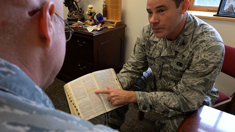 Chaplain (Col.) Ted Wilson, 88th Air Base Wing chaplain, provides spiritual counsel to Tech. Sgt. Daniel Thornton, 88th Air Base Wing bioenvironmental engineer, at Wright-Patterson Air Force Base July 12, 2017. The 88 ABW Chaplain Services are one agencies participating in the Integrated Delivery System that works to provide support to members of the Wright-Patterson Air Force Base community. (U.S. Air Force photo/Michelle Gigante)