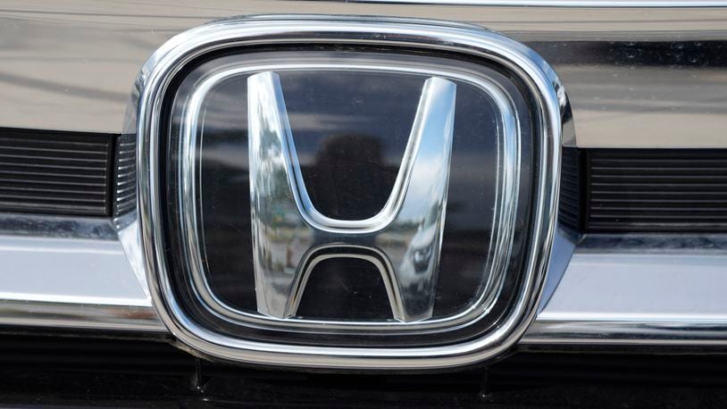 The company logo shinesoff the grille of an unsold 2021 Pilot sports-utility vehicle outside a Honda dealership Sunday, Sept. 12, 2021, in Highlands Ranch, Colo. Honda is recalling nearly 723,000 SUVs and pickup trucks, Friday, Dec. 3,  because the hoods can open while the vehicles are moving. The recall covers certain 2019 Passports, 2016 through 2019 Pilots and 2017 through 2020 Ridgeline pickups.   (AP Photo/David Zalubowski)