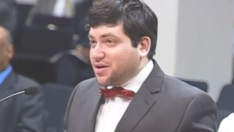 Nicholas Rossi, who also goes by the name Nicholas Alahverdian, speaks during a public comment portion of a Dayton City Commission meeting in August 2015. Rossi asked the commission to approve a resolution condemning the Armenian genocide. CONTRIBUTED