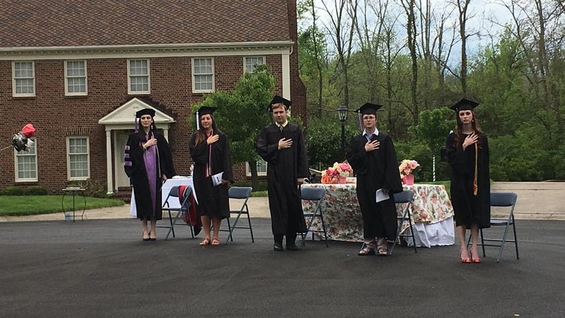 Neighbors of Southbridge Lane in Washington Twp. gathered for a graduation ceremony of 5 graduates who live on the street on Saturday, May 16, 2020. Staff Photo / Sarah Franks