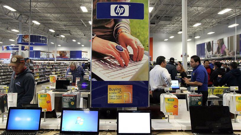SAN FRANCISCO - JUNE 01:  An ad for HP laptops is displayed at a Best Buy store June 1, 2010 in San Francisco, California. Hewlett-Packard Co. announced today that they plan to cut 9,000 jobs over several years as they invest $1 billion to automate data centers and make operational changes. (Photo by Justin Sullivan/Getty Images)