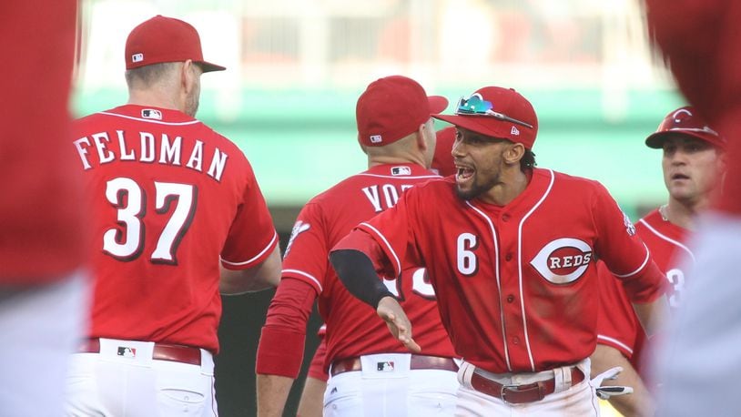 The Reds’ Billy Hamilton congratulates Scott Feldman after a victory against the Giants on Sunday, May 7, 2017, at Great American Ball Park in Cincinnati. David Jablonski/Staff