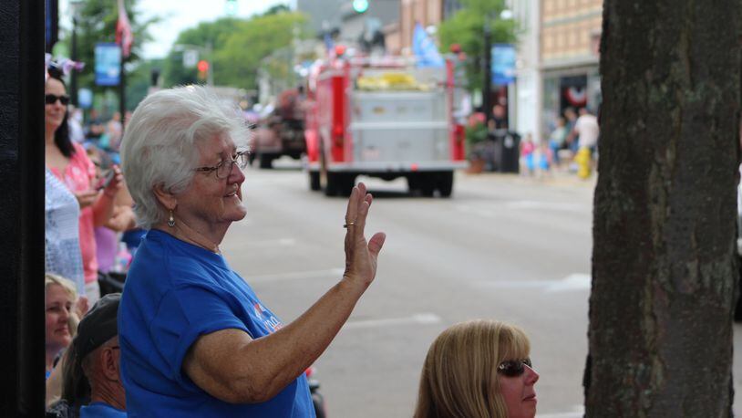 Betty Whitaker, 80, watches the parade at the opening day of Miamisburg’s bicentenial celebration, along with her daughter and grandchildren. CORNELIUS FROLIK / STAFF