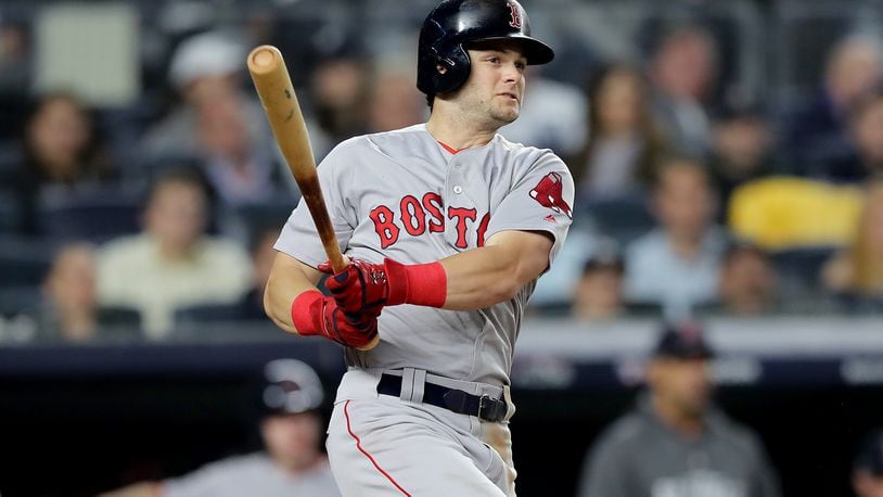 NEW YORK, NEW YORK - OCTOBER 08:  Andrew Benintendi #16 of the Boston Red Sox hits a 3 RBI double against Lance Lynn #36 of the New York Yankees during the fourth inning in Game Three of the American League Division Series at Yankee Stadium on October 08, 2018 in the Bronx borough of New York City. (Photo by Elsa/Getty Images)