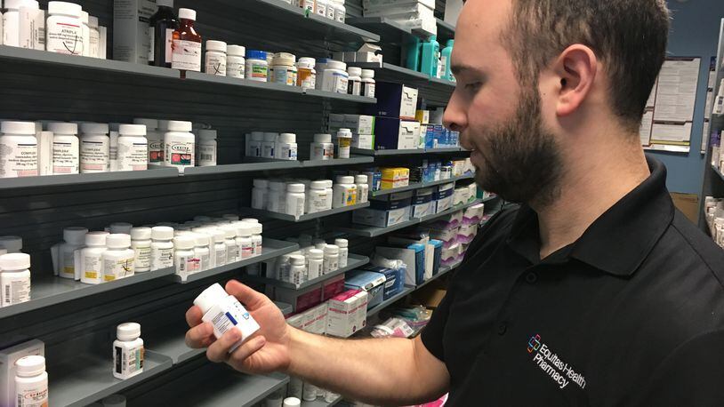 Pharmacist Phil Pauvlinch works at the Equitas Health Pharmacy in Dayton, which was just recognized for its inclusiveness. KATIE WEDELL/STAFF