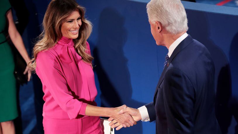 ST LOUIS, MO - OCTOBER 09: Melania Trump (L) shakes hands with former U.S. President Bill Clinton before the town hall debate at Washington University on October 9, 2016 in St Louis, Missouri. This is the second of three presidential debates scheduled prior to the November 8th election. (Photo by Scott Olson/Getty Images)