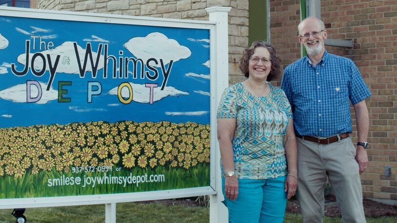 Jane and David Wickham in front of their new business - The Joy & Whimsy Depot - in Lewisburg. The couple's dream finally became a reality on June 5 after more than a year delay due to the COVID-19 pandemic. CONTRIBUTED