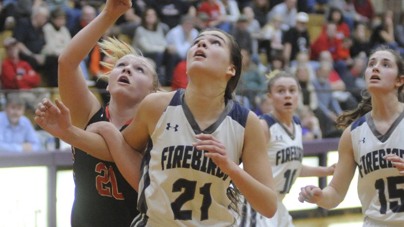 Tecumseh Macy Berner (left) and Fairmont’s Madeline Westbeld position for a rebound. Tecumseh defeated Fairmont 54-45 in a girls high school basketball D-I sectional semifinal on Wednesday at Vandalia-Butler. MARC PENDLETON / STAFF