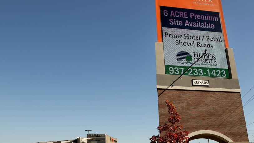 A sign at the Rose Music Center advertises to drivers on I-70 that land is available. JIM WITMER/STAFF
