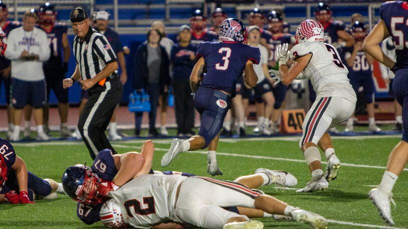 Piqua running back Jasiah Medley breaks free and away from Tippecanoe's Cole Coppock on a 56-yard run in the second quarter Friday night that set up the Indians' third touchdown. Jeff Gilbert/CONTRIBUTED