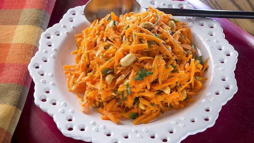 Cilantro Carrot Salad gets a super-spice boost from turmeric, which has anti-inflammatory properties. (Tammy Ljungblad/Kansas City Star/TNS)
