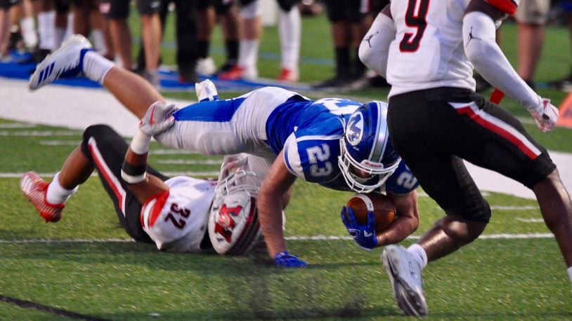 Miamisburg running back Jon Yerkins fights for extra yardage during the Vikings’ home game against Wayne Friday, Sept. 18, 2018. Nick Dudukovich/CONTRIBUTED
