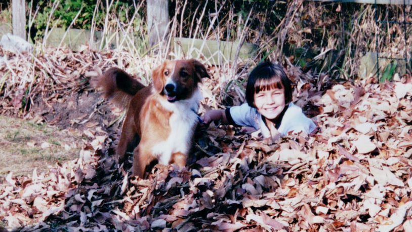 Flashback: Young Jordan (Karin Spicer's daughter) plays in the fall leaves with her pet Lucy. KARIN SPICER/CONTRIBUTED