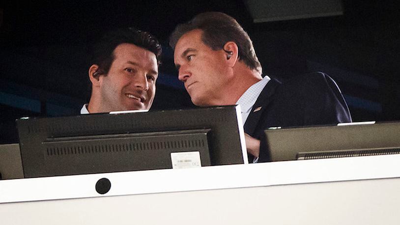 Tony Romo (left) works in the broadcast booth with Jim Nantz during the first half of an NFL football game between the Dallas Cowboys and the Los Angeles Chargers on Thursday, Nov. 23, 2017 at AT&T Stadium in Arlington, Texas. (Smiley N. Pool/Dallas Morning News/TNS)