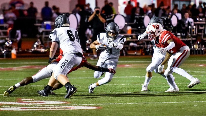 Lakota East’s Jeff Garcia finds some daylight and heads upfield during Friday’s game at Lakota West. NICK GRAHAM/STAFF
