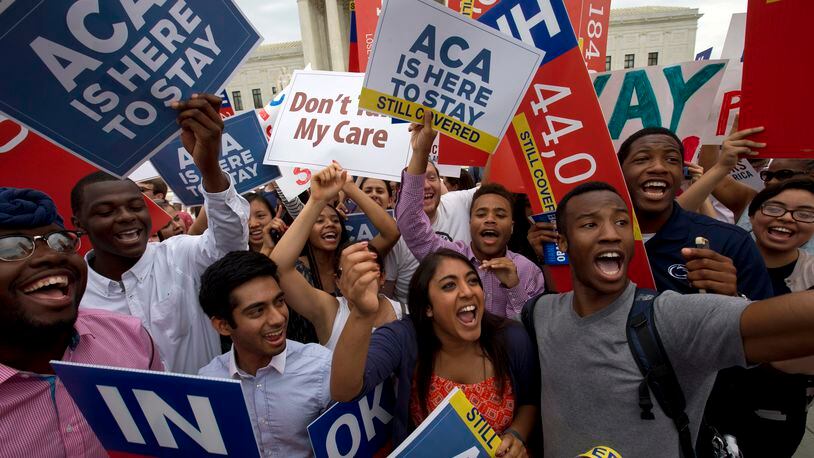 Students cheer as they hold up signs outside of the Supreme Court in Washington, D.C, supporting the Affordable Care Act. Republican foes of President Barack Obama’s signature health reform law have already begun taking steps to repeal it. AP Photo