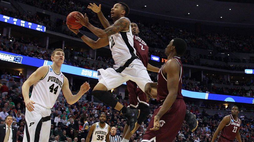 DENVER, CO - MARCH 17: Vince Edwards #12 of the Purdue Boilermakers shoots the ball ober Daniel Green #2 of the Arkansas Little Rock Trojans during the first round of the 2016 NCAA Men’s Basketball Tournament at the Pepsi Center on March 17, 2016 in Denver, Colorado. (Photo by Justin Edmonds/Getty Images)