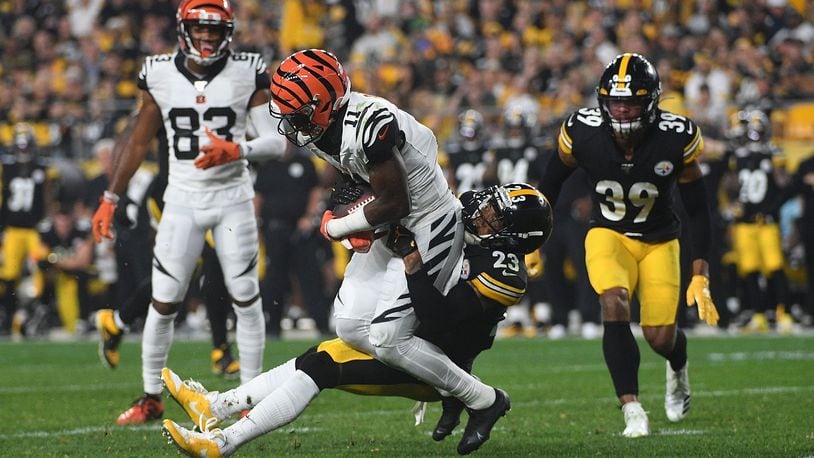 PITTSBURGH, PA - SEPTEMBER 30: John Ross #11 of the Cincinnati Bengals is wrapped up for a tackle by Joe Haden #23 of the Pittsburgh Steelers in the second half during the game at Heinz Field on September 30, 2019 in Pittsburgh, Pennsylvania. (Photo by Justin Berl/Getty Images)