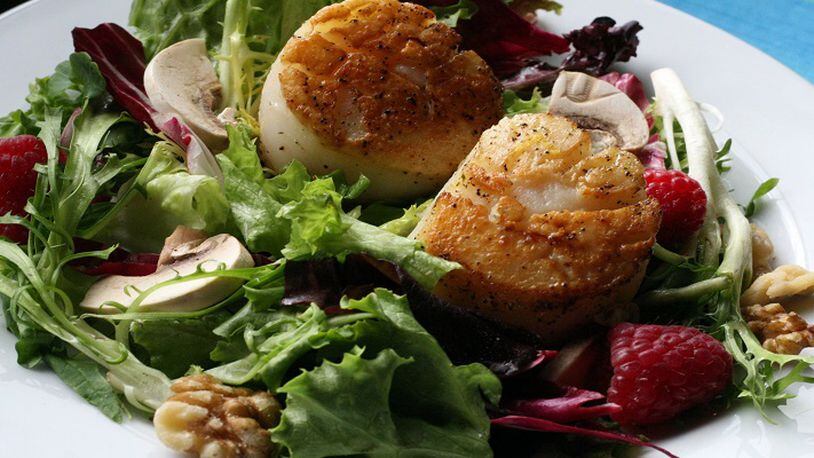 Pan-seared Scallops with Fresh Greens and Raspberries, in a June 2008 file image. (Mary Schroeder/Detroit Free Press/TNS)
