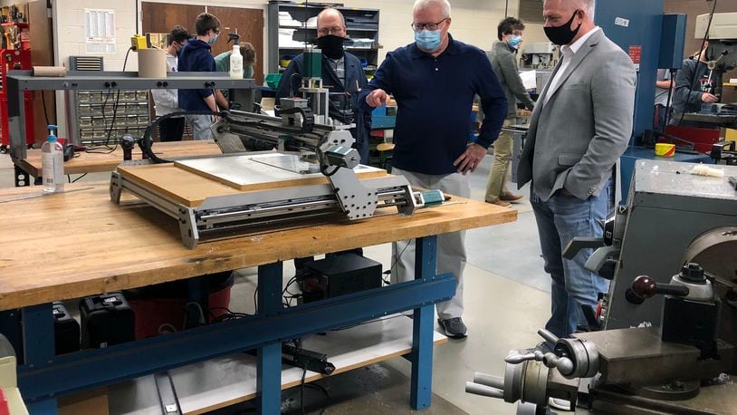 Jim Burt (right), president at Ernst Metal Technologies LLC in Moraine, toured the engineering and manufacturing lab space at Centerville High School. CHS engineering teacher Dan Stacy (center) and advanced manufacturing teacher Ryan Muhlenkamp (left) shared information about the tools that are currently available. CONTRIBUTED PHOTO
