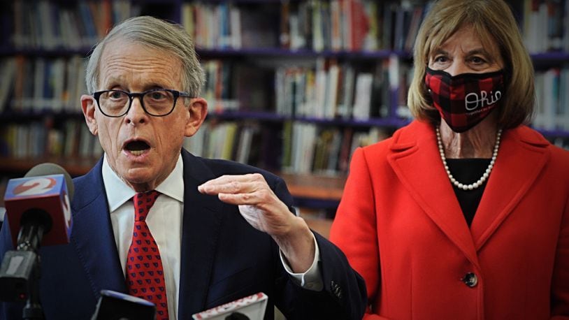 Gov. Mike DeWine addresses the media after touring a COVID-19 vaccination clinic at Thurgood Marshall High school in Dayton. Staff photo by Marshall Gorby
