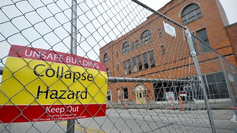 The 100 block of West Main Street in Troy is completely blocked off June 27, 2023, after city officials declared the controversial Tavern building there unsafe. MARSHALL GORBY \STAFF