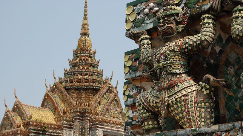 At Wat Arun, the Temple of the Dawn, in Bangkok, Thailand, pieces of porcelain adorn the temples and the mythological creatures lining the facade. (Susan Hegger/St. Louis Post-Dispatch/TNS)
