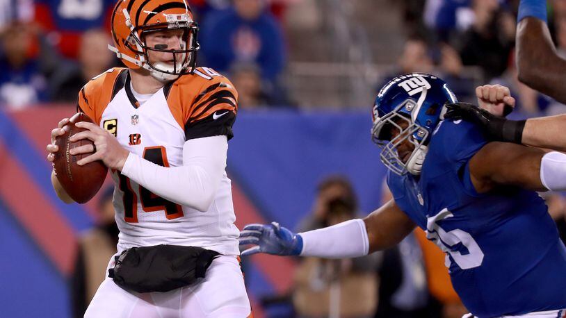 EAST RUTHERFORD, NJ - NOVEMBER 14: Andy Dalton #14 of the Cincinnati Bengals looks to throw a pass against the New York Giants during the first half of the game at MetLife Stadium on November 14, 2016 in East Rutherford, New Jersey. (Photo by Michael Reaves/Getty Images)
