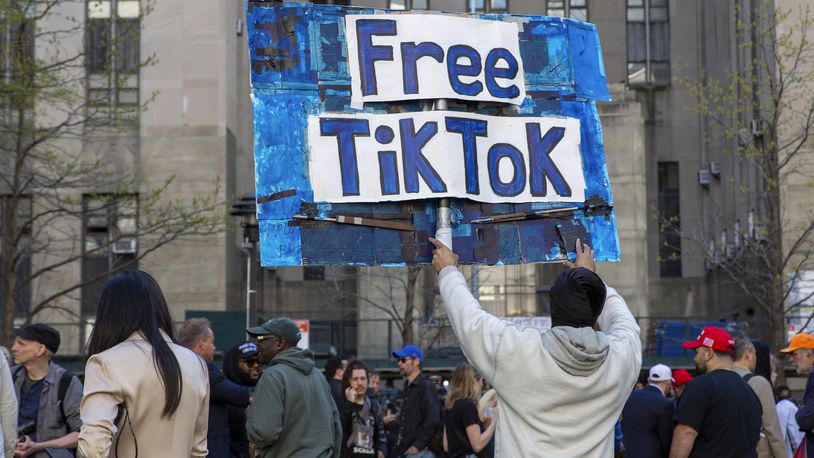 FILE - A man carries a Free TikTok sign in front of the courthouse where the hush-money trial of Donald Trump got underway April 15, 2024, in New York. The House has passed legislation Saturday, April 20, to ban TikTok in the U.S. if its China-based owner doesn't sell its stake, sending it to the Senate as part of a larger package of bills that would send aid to Ukraine and Israel. House Republicans' decision to add the TikTok bill to the foreign aid package fast-tracked the legislation after it had stalled in the Senate. The aid bill is a priority for President Joe Biden that has broad congressional support. (AP Photo/Ted Shaffrey, File)