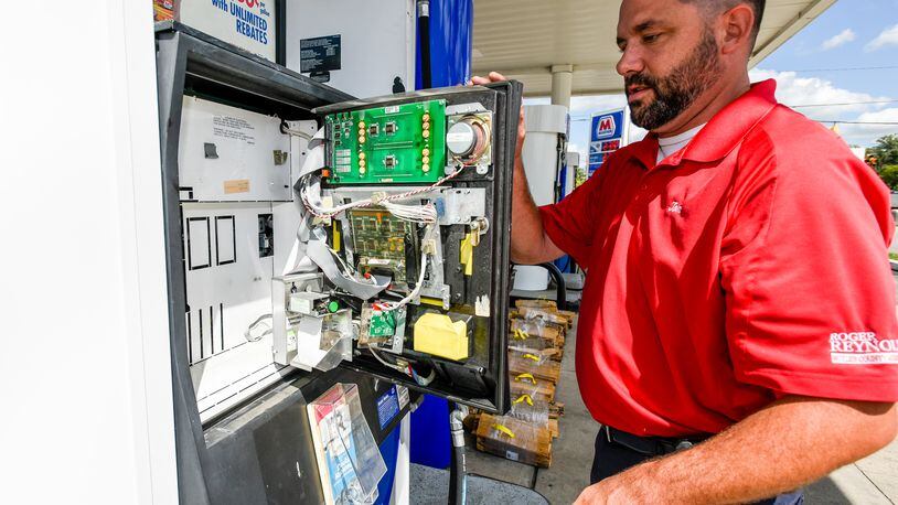 Butler County Auditor inspectors found another illegal credit card skimming device at a gas station on the Hamilton/Fairfield border on Wednesday, Dec. 21. NICK GRAHAM/STAFF