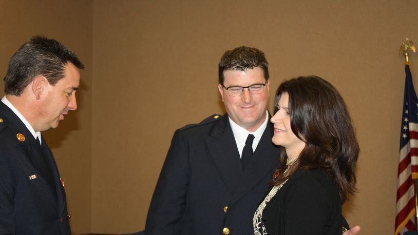West Chester Twp. Fire Chief Rick Prinz presented his new assistant chief for operations Stephen Oughterson to the trustees for confirmation Feb. 28. Pictured are Prinz and Oughterson with his wife, Debra.