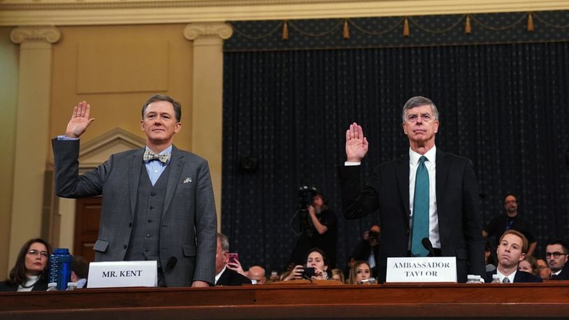 From left, George Kent, a senior State Department official in charge of Ukraine policy, and William Taylor, the top U.S. diplomat in Ukraine, are sworn in before the House Intelligence Committee in Washington on Wednesday, Nov. 13, 2019. Lawmakers are considering whether to impeach President Donald Trump for what Democrats say was an effort to use the power of his office for political gain. (Erin Schaff/The New York Times)