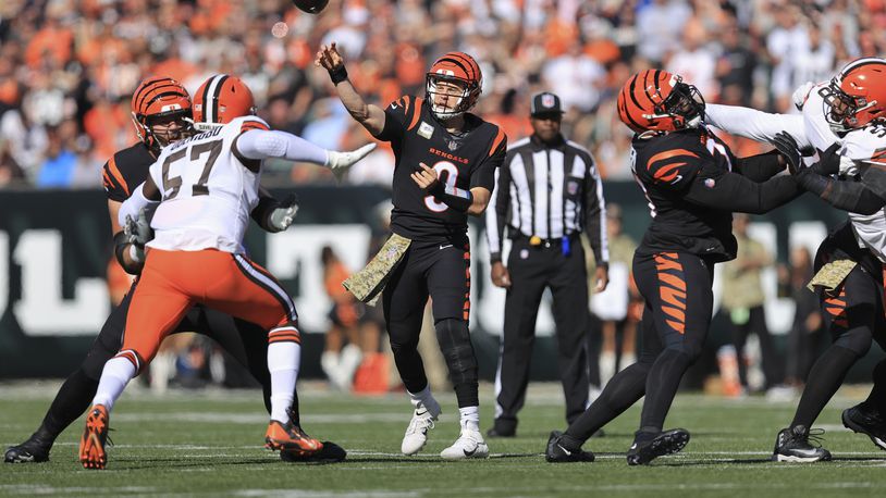 Cincinnati Bengals quarterback Joe Burrow (9) throws during the first half of an NFL football game against the Cleveland Browns, Sunday, Nov. 7, 2021, in Cincinnati. (AP Photo/Aaron Doster)