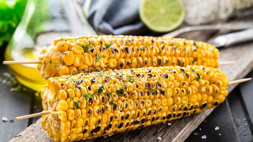 Grilled sweet corn can be done up a lot of different ways. (Fotolia)